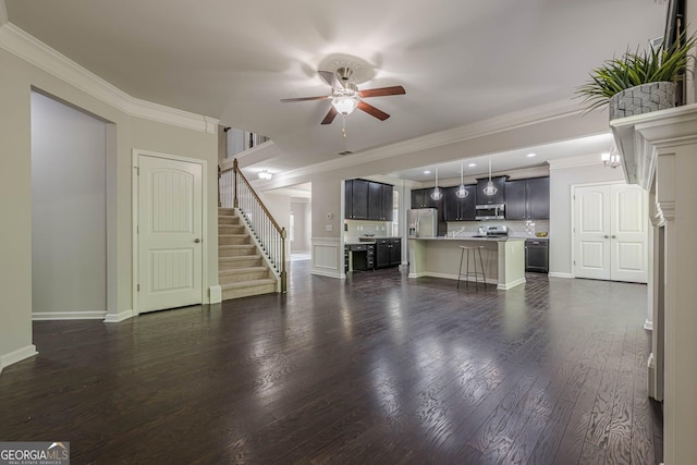 207 Cherokee Reserve Cir, Canton, GA 30115 - unfurnished living room with crown molding, stairway, ceiling fan, dark wood-style floors, and baseboards