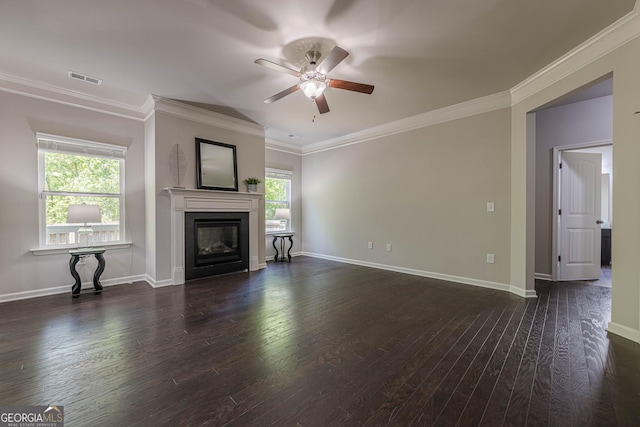 207 Cherokee Reserve Cir, Canton, GA 30115 - unfurnished living room featuring wood-type flooring, crown molding, a ceiling fan, and a glass covered fireplace