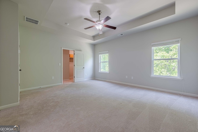 207 Cherokee Reserve Cir, Canton, GA 30115 - unfurnished room with a tray ceiling, a ceiling fan, visible vents, baseboards, and light colored carpet