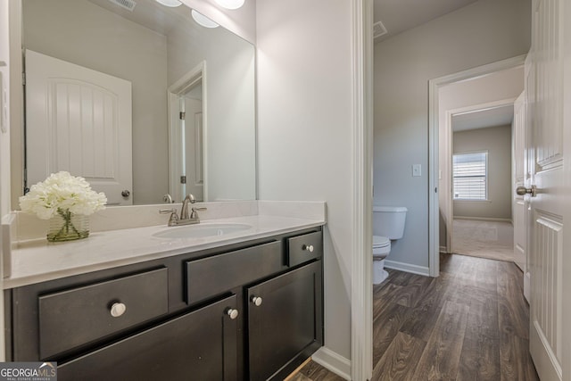 207 Cherokee Reserve Cir, Canton, GA 30115 - bathroom with wood finished floors, toilet, vanity, and baseboards