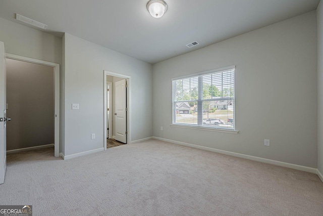 207 Cherokee Reserve Cir, Canton, GA 30115 - unfurnished bedroom featuring visible vents, carpet, and baseboards