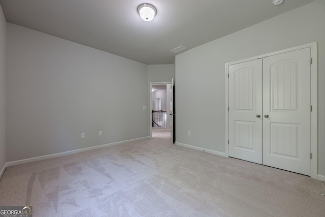 207 Cherokee Reserve Cir, Canton, GA 30115 - unfurnished bedroom featuring a closet, carpet, and baseboards