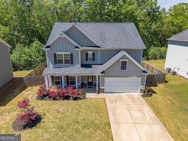 207 Cherokee Reserve Cir, Canton, GA 30115 - view of front facade with fence, board and batten siding, a porch, and concrete driveway