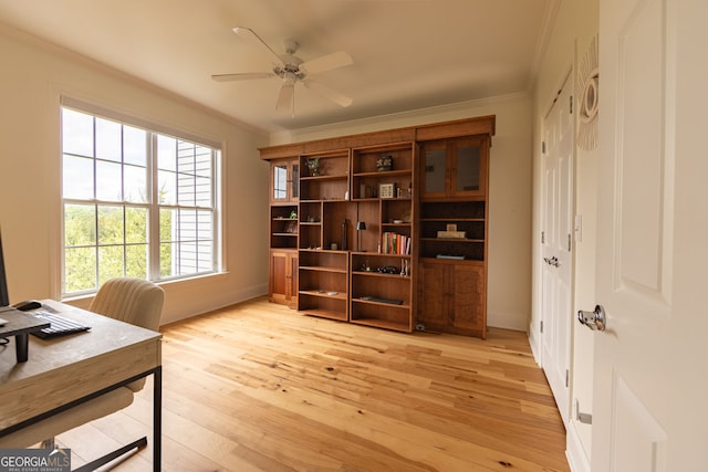 office with crown molding, light wood finished floors, ceiling fan, and baseboards