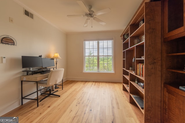 office with crown molding, light wood-type flooring, baseboards, and a ceiling fan
