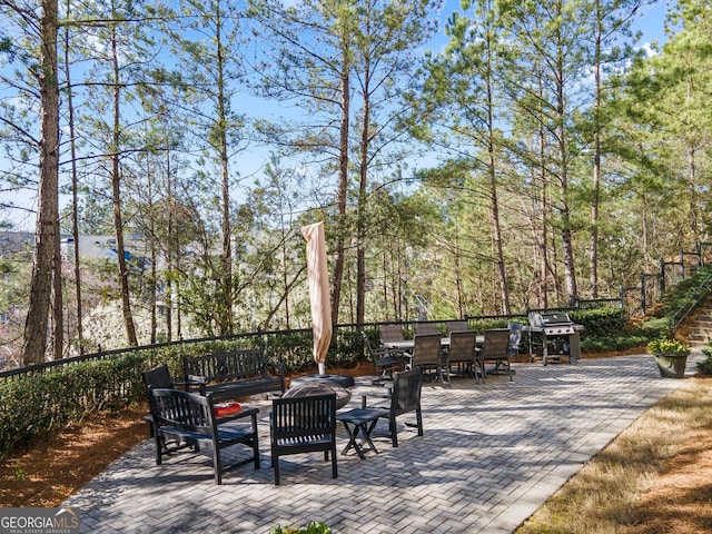 view of patio / terrace with outdoor dining space, area for grilling, and an outdoor living space