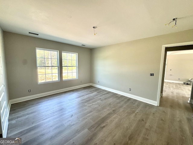 270 Abigail Cir, Ellabell, GA 31308 - spare room featuring dark wood-style flooring and baseboards