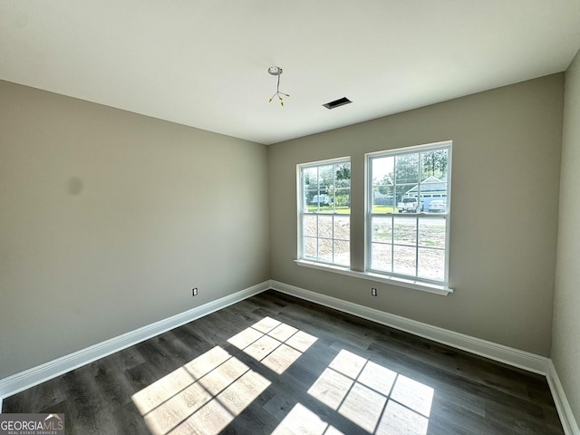 270 Abigail Cir, Ellabell, GA 31308 - spare room featuring baseboards and dark wood-style floors
