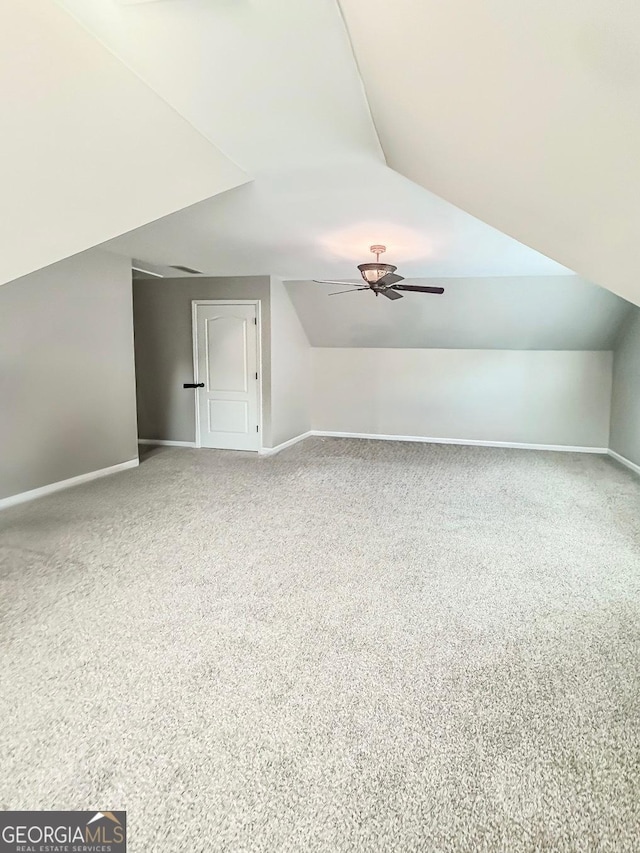 1485 Oglethorpe Run Ln, Suwanee, GA 30024 - bonus room with a ceiling fan, carpet flooring, vaulted ceiling, and baseboards