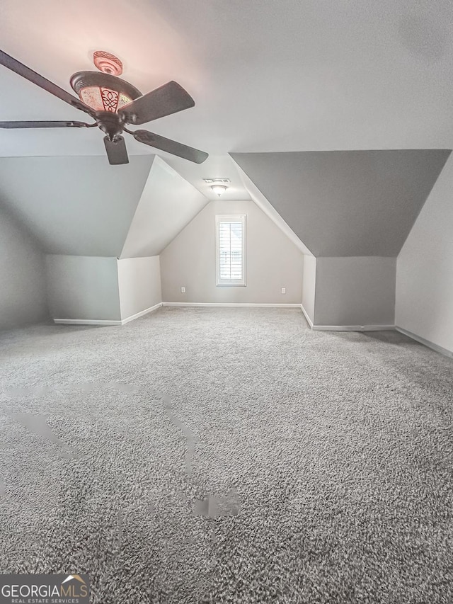 1485 Oglethorpe Run Ln, Suwanee, GA 30024 - bonus room with lofted ceiling, carpet, and baseboards