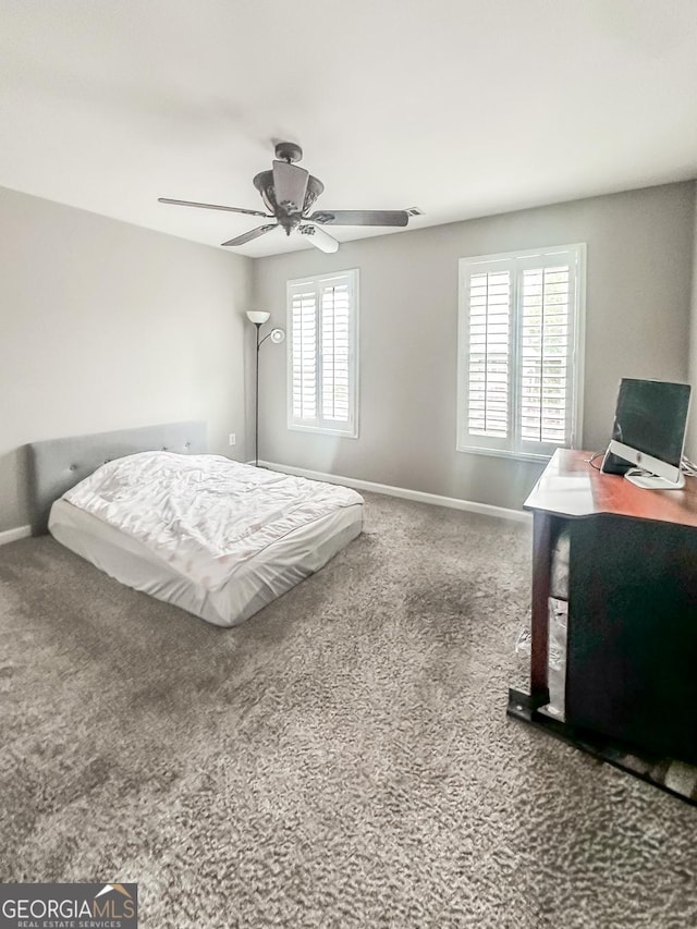 1485 Oglethorpe Run Ln, Suwanee, GA 30024 - carpeted bedroom featuring baseboards, ceiling fan, and multiple windows