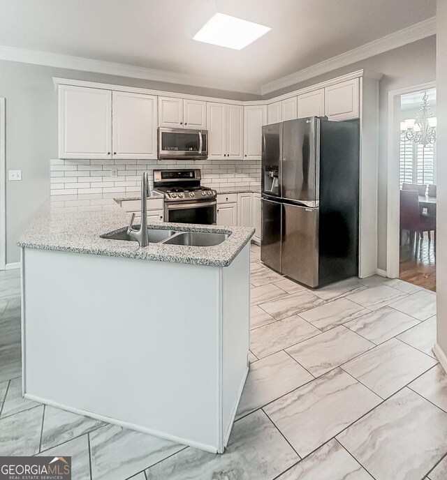 1485 Oglethorpe Run Ln, Suwanee, GA 30024 - kitchen with stainless steel appliances, light stone countertops, ornamental molding, and marble finish floor