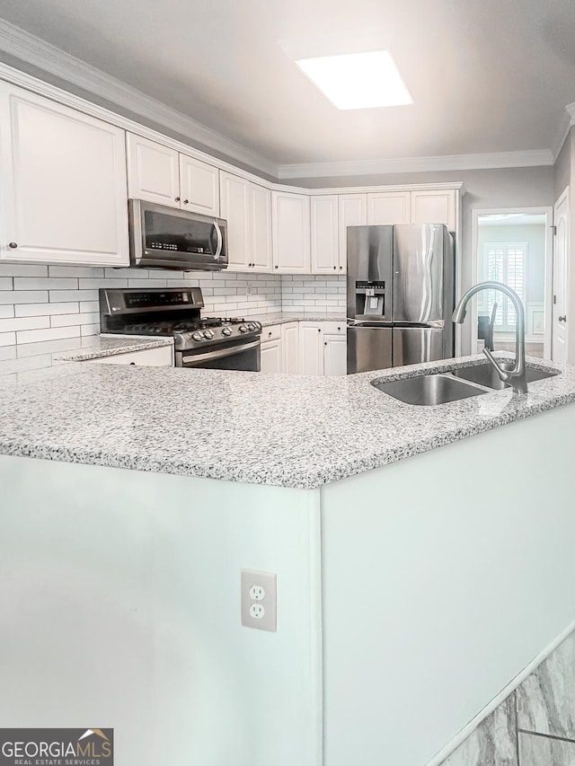 1485 Oglethorpe Run Ln, Suwanee, GA 30024 - kitchen with white cabinetry, backsplash, appliances with stainless steel finishes, and a sink
