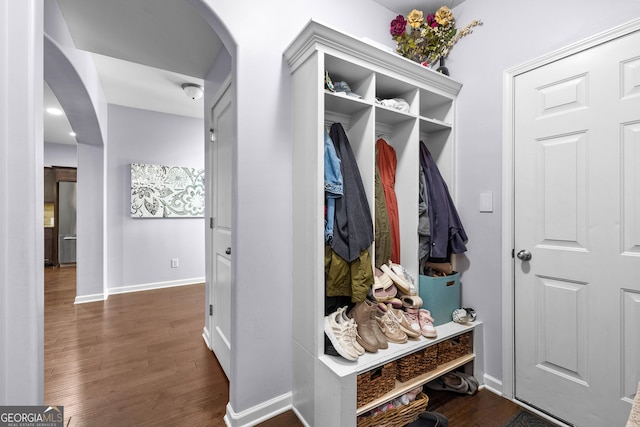 171 Cliffhaven Cir, Newnan, GA 30263 - mudroom featuring arched walkways, baseboards, and dark wood-style floors