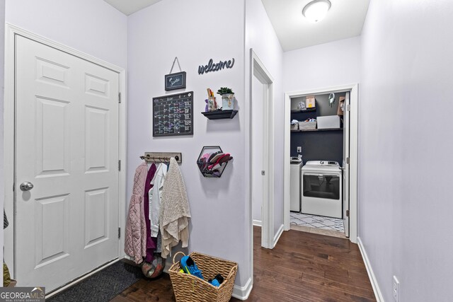 171 Cliffhaven Cir, Newnan, GA 30263 - hallway featuring baseboards, dark wood finished floors, and washer and clothes dryer