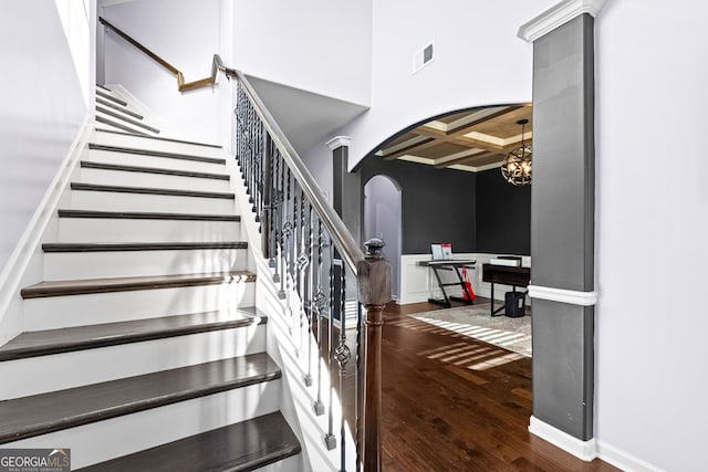 171 Cliffhaven Cir, Newnan, GA 30263 - stairway featuring wood-type flooring, arched walkways, baseboards, visible vents, and coffered ceiling
