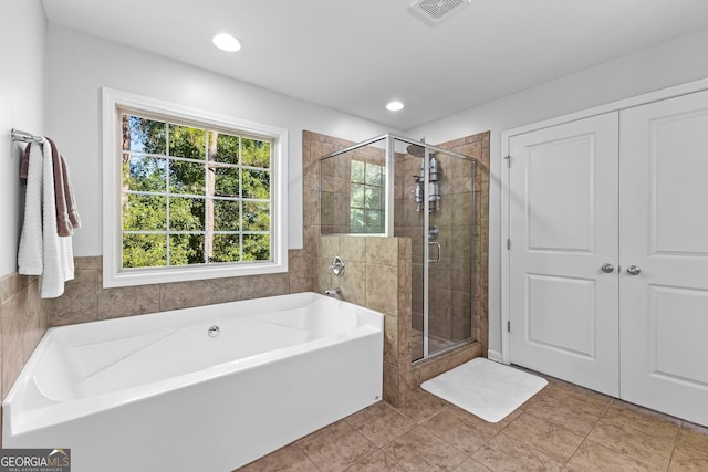 171 Cliffhaven Cir, Newnan, GA 30263 - full bath featuring tile patterned flooring, a shower stall, a bath, and visible vents