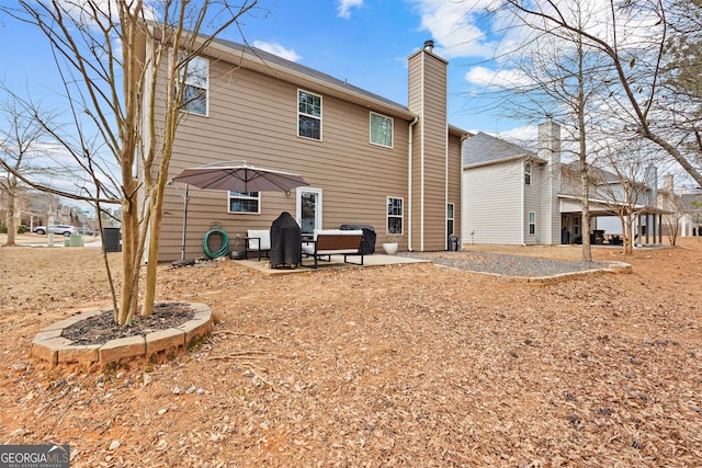 171 Cliffhaven Cir, Newnan, GA 30263 - rear view of property with a chimney and a patio area