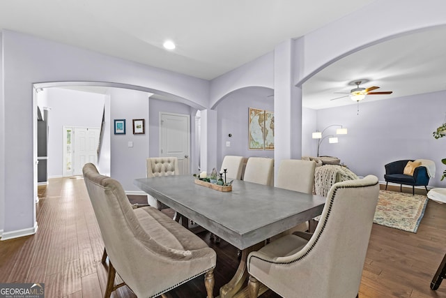 171 Cliffhaven Cir, Newnan, GA 30263 - dining space featuring a ceiling fan, dark wood-style flooring, arched walkways, baseboards, and recessed lighting