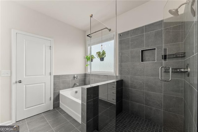 837 Porches Way, Dacula, GA 30019 - bathroom featuring a shower stall, tile patterned floors, and a garden tub