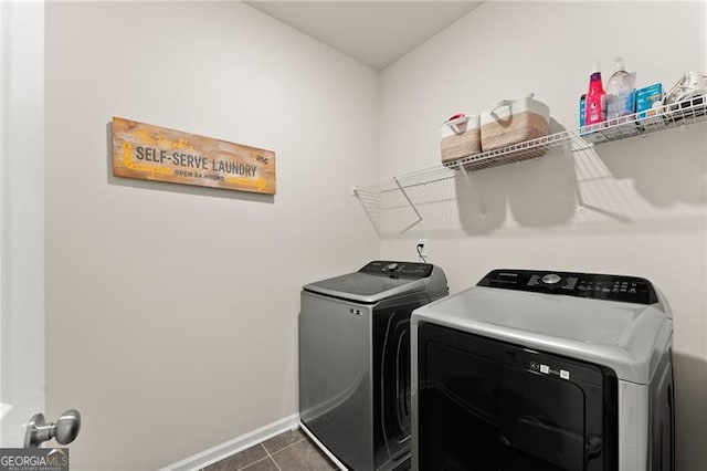 837 Porches Way, Dacula, GA 30019 - washroom with washing machine and dryer and dark tile patterned floors