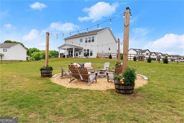 837 Porches Way, Dacula, GA 30019 - back of property with a lawn and a fire pit