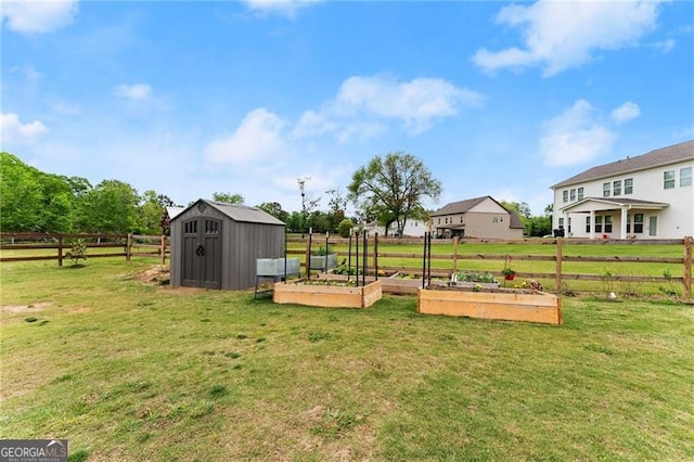 837 Porches Way, Dacula, GA 30019 - view of yard featuring a storage shed and a vegetable garden