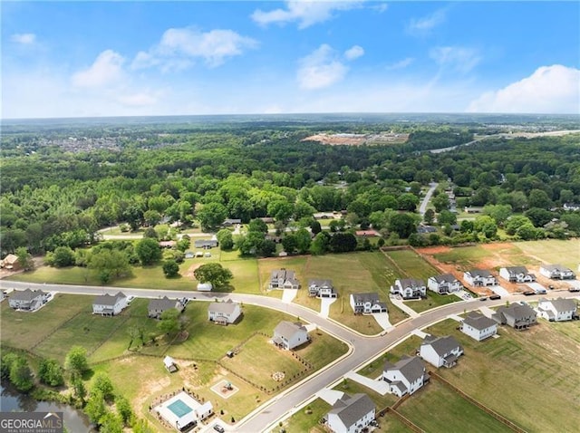 837 Porches Way, Dacula, GA 30019 - aerial perspective of suburban area with a heavily wooded area