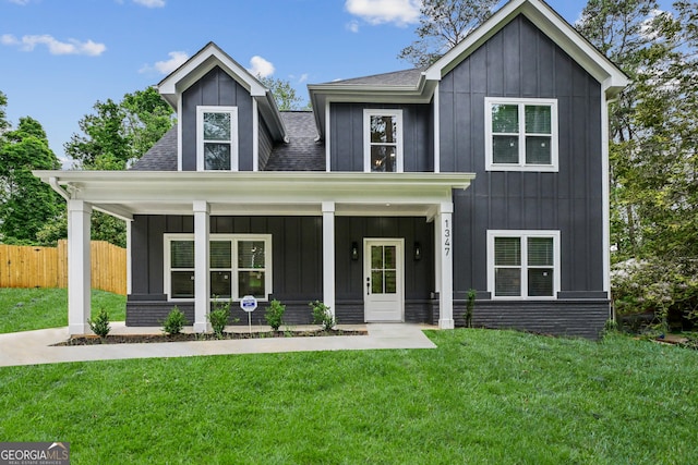 1347 Midlawn Dr, Decatur, GA 30032 - modern inspired farmhouse with fence, board and batten siding, a front yard, and roof with shingles