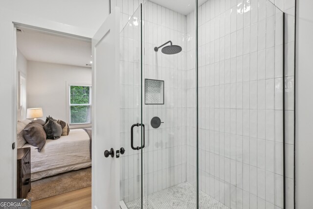 1347 Midlawn Dr, Decatur, GA 30032 - bathroom with wood finished floors, connected bathroom, and a stall shower