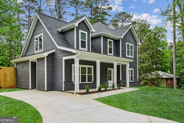 1347 Midlawn Dr, Decatur, GA 30032 - view of front of property featuring board and batten siding, a shingled roof, fence, a porch, and a front lawn