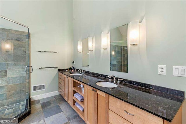 3720 Harts Pl, Atlanta, GA 30341 - bathroom with visible vents, a stall shower, double vanity, and a sink