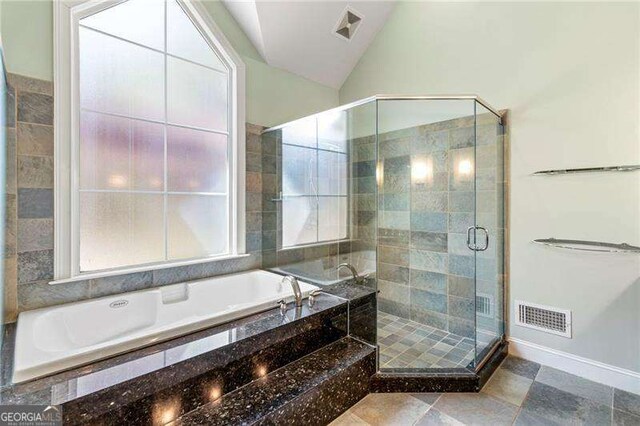 3720 Harts Pl, Atlanta, GA 30341 - bathroom featuring visible vents, a shower stall, a garden tub, and lofted ceiling