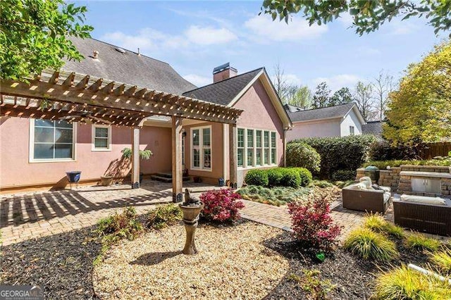 3720 Harts Pl, Atlanta, GA 30341 - back of house featuring stucco siding, a pergola, a patio area, and an outdoor hangout area