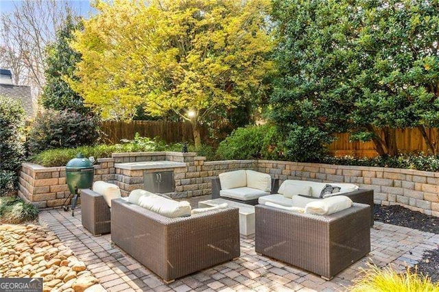 3720 Harts Pl, Atlanta, GA 30341 - view of patio with an outdoor living space and a fenced backyard