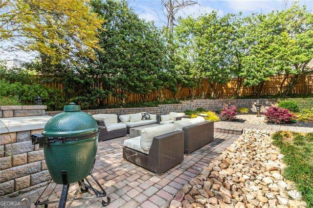 3720 Harts Pl, Atlanta, GA 30341 - view of patio with an outdoor hangout area and a fenced backyard