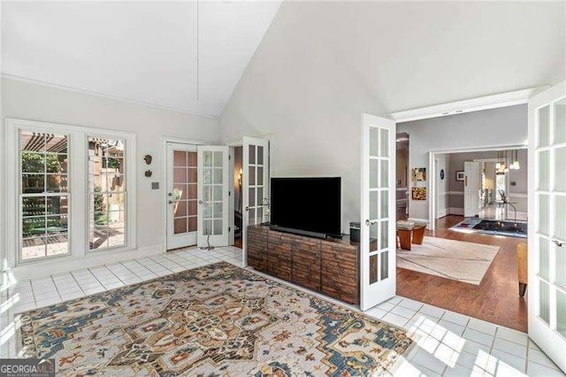 3720 Harts Pl, Atlanta, GA 30341 - unfurnished living room featuring tile patterned floors, french doors, and high vaulted ceiling