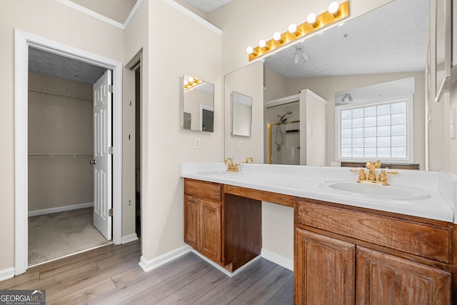1452 Evanston Ln, Marietta, GA 30062 - full bath with double vanity, a sink, a shower stall, and wood finished floors