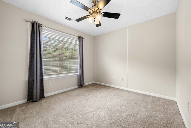 1452 Evanston Ln, Marietta, GA 30062 - carpeted spare room featuring a ceiling fan, visible vents, and baseboards