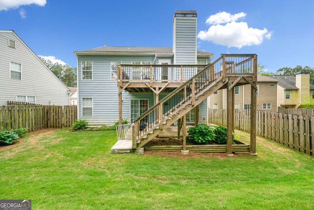 1452 Evanston Ln, Marietta, GA 30062 - back of property with a deck, a chimney, stairway, a yard, and a fenced backyard