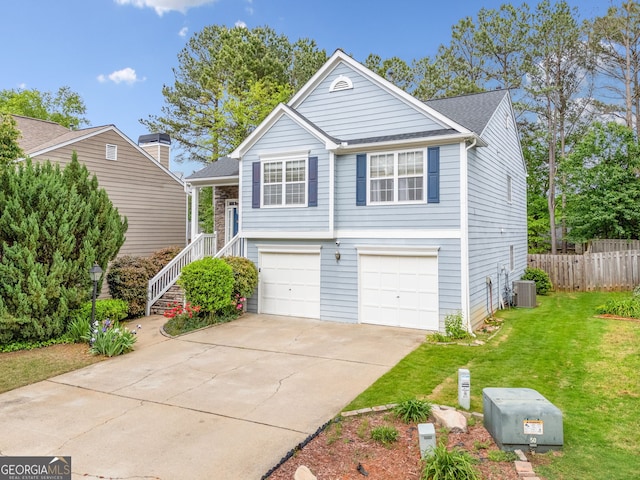 1452 Evanston Ln, Marietta, GA 30062 - view of front of property with a front yard, a garage, cooling unit, driveway, and fence