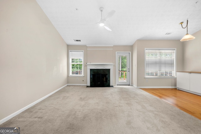 1452 Evanston Ln, Marietta, GA 30062 - unfurnished living room with ceiling fan, baseboards, visible vents, and light carpet