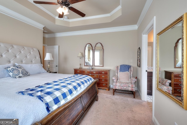 bedroom featuring a tray ceiling, a ceiling fan, baseboards, ornamental molding, and light colored carpet