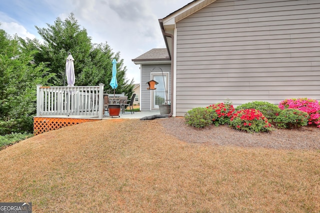 view of yard featuring a wooden deck