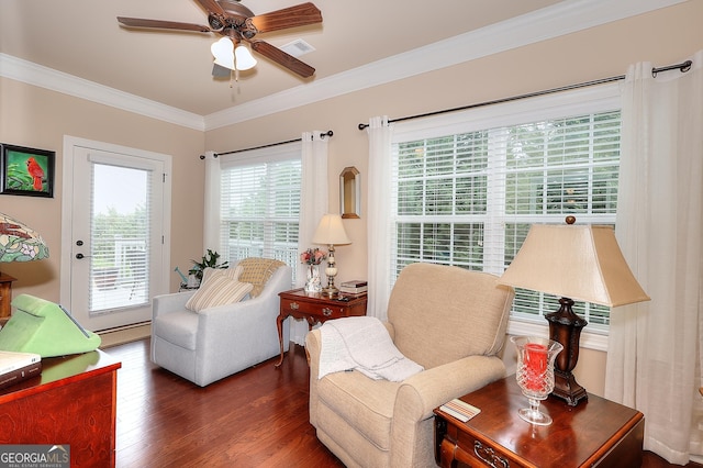 living room featuring visible vents, wood finished floors, ceiling fan, and ornamental molding