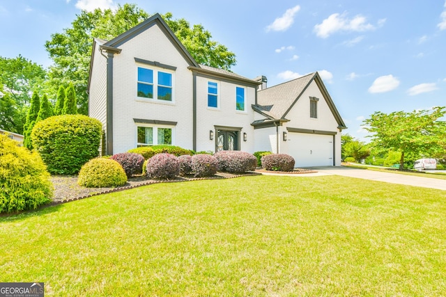 4115 Ancroft Cir, Peachtree Corners, GA 30092 - traditional home with brick siding, driveway, french doors, and a front lawn