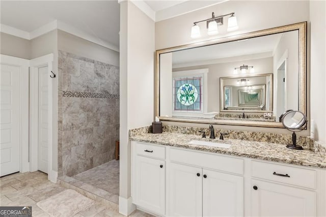 full bathroom with walk in shower and vanity