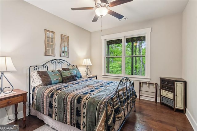 bedroom with wood-type flooring, baseboards, and ceiling fan