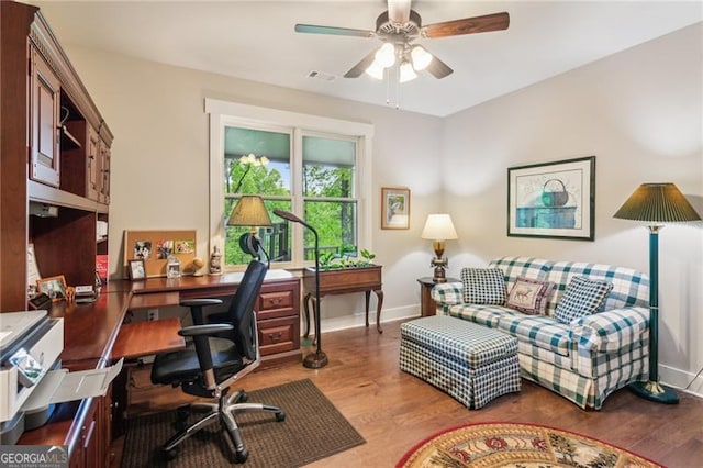 office featuring ceiling fan, wood finished floors, and baseboards