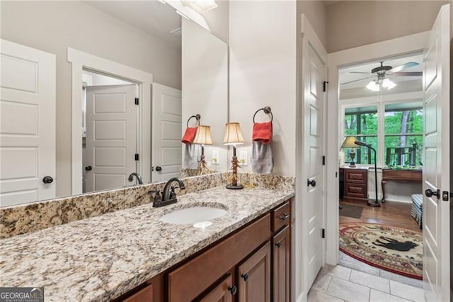 bathroom featuring vanity, a ceiling fan, and tile patterned floors